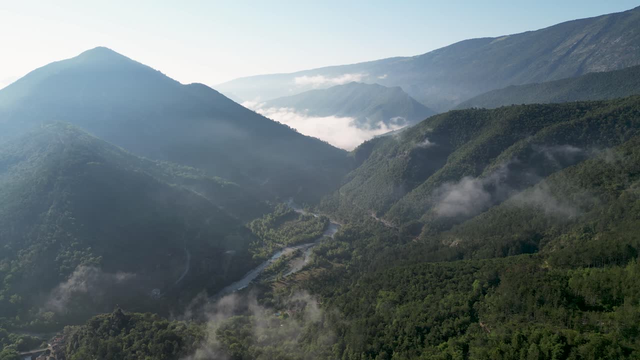 Panoramic view of the French Pyrenees, showcasing breathtaking peaks and verdant surroundings.