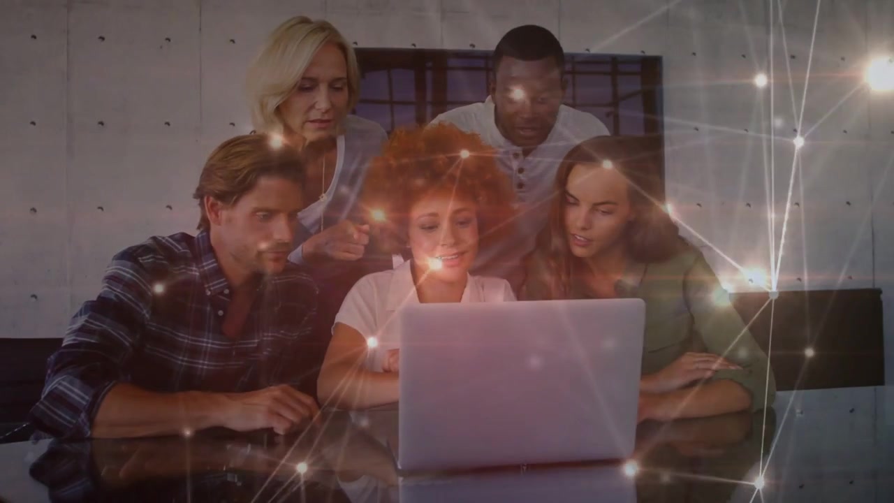 Woman operating laptop, team leaning and reviewing business data, network lines glowing over faces