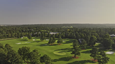 Augusta-Georgia-Aerial-v57-cinematic-low-drone-flyover-National-Golf-Course-capturing-lush-manicured-fairways,-luxurious-clubhouse-and-cityscape-views---Shot-with-Mavic-3-Pro-Cine---October-2023