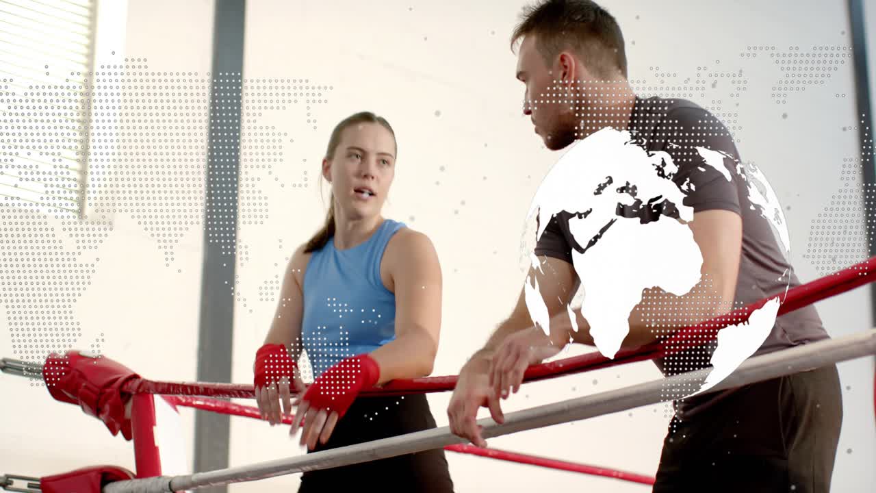 Female boxer leaning on ring ropes after round, resting and taking coach cues globe overlaying them