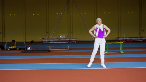 senior woman warming up indoors