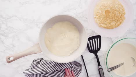 making crepes in a small frying pan