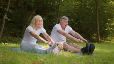 senior couple stretching outdoors