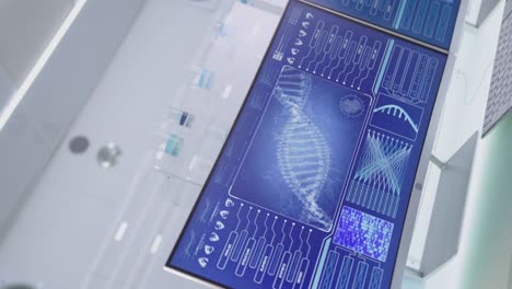 Coronavirus and DNA models on computer screen. Studying DNA damage. Spinning video effect