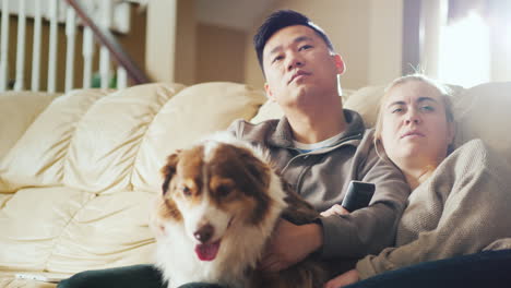 young multi-etna couple watch tv together