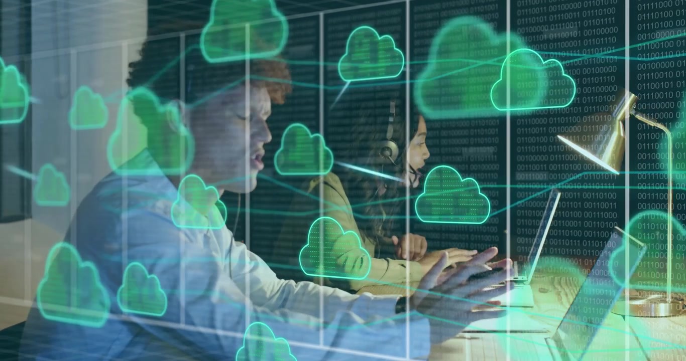 Tech coders typing driving clouds linking into network graph showing data flow coder glancing peer