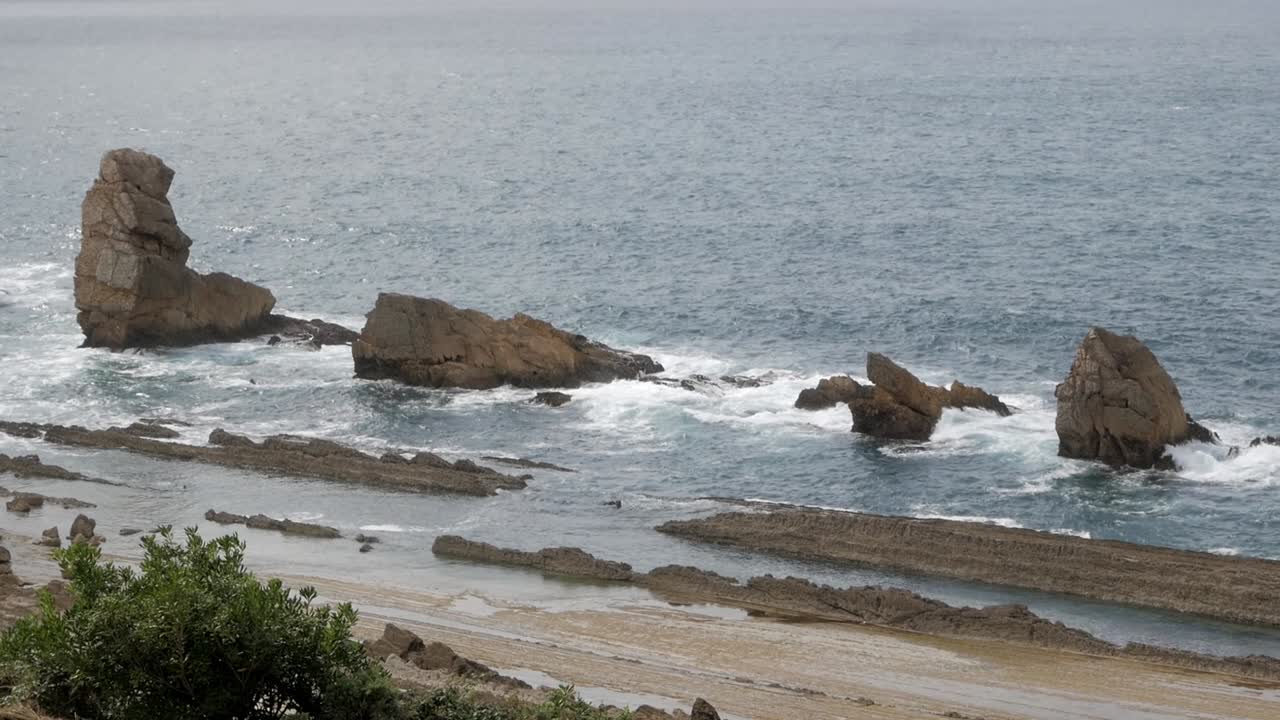 Rock formations on the coast of Arnia Beach, Soto de la Marina, Spain