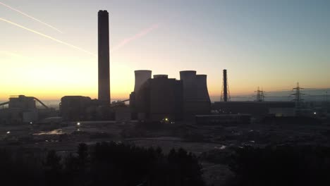 fiddlers ferry power station aerial rising view over demolished cooling towers wreckage in early morning sunrise