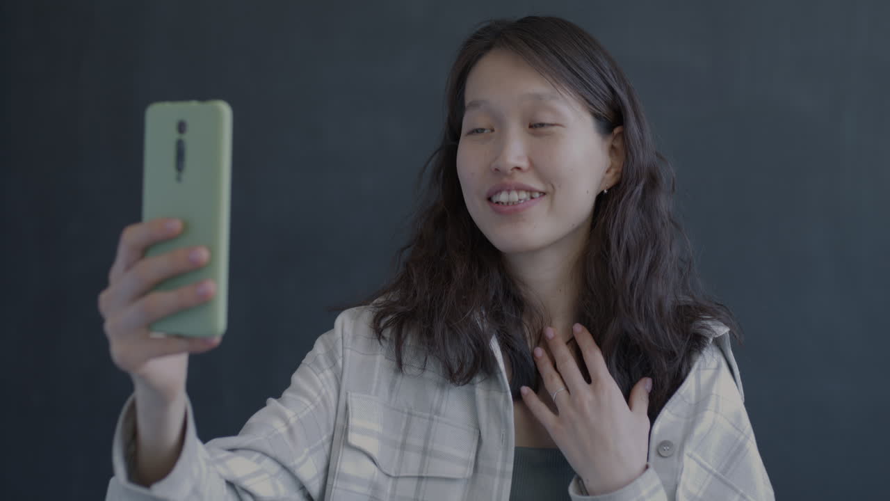 Woman taking a selfie or video call