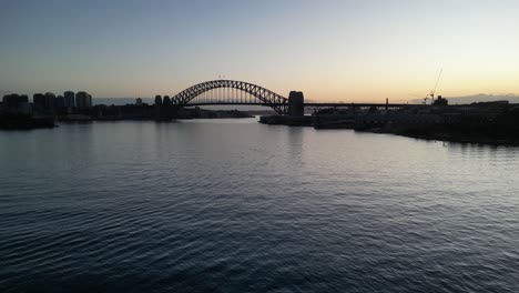 sydney harbour bridge on a quite summer morning sunrise