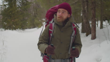 man hiking in nature on winter day
