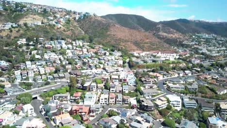 Aerial,-drone-shot-panning-around-Victoria-beach,-community-of-house,-in-Laguna-Beach,-California,-USA