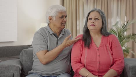 Guilty-Indian-old-husband-saying-sorry-to-his-wife