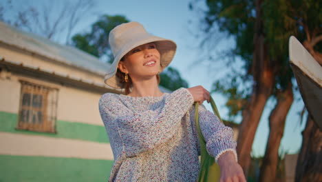 portrait happy traveler enjoy evening nature. smiling carefree girl in sunlight