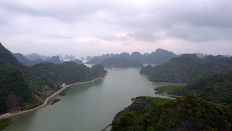 Gia-Luan-harbor-in-Cat-Ba-Island-Vietnam-with-sea-entrance-of-Lan-Ha-Bay,-Aerial-flyover-shot