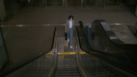 woman on escalator in metro station