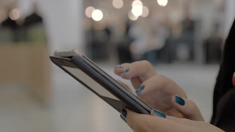 Woman-with-cellphone-in-shopping-mall