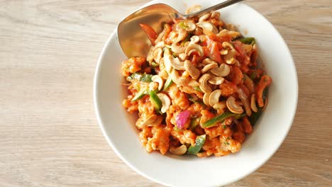 Cashew-nut-salad-on-a-plate-on-table-,