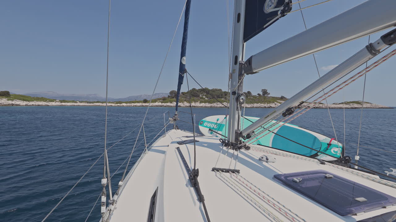 view from a yacht of a greek island at sunrise