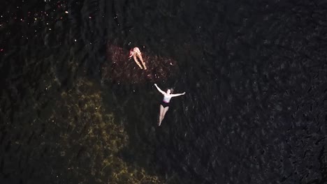 people relaxing in fresh water swimming hole darwin norther territory australia