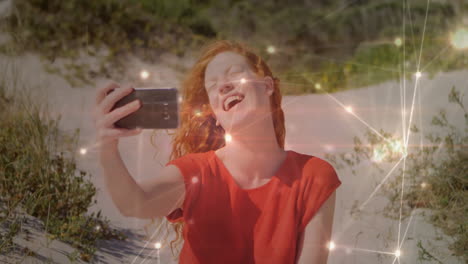 on beach, woman taking selfie with glowing light effects like animation