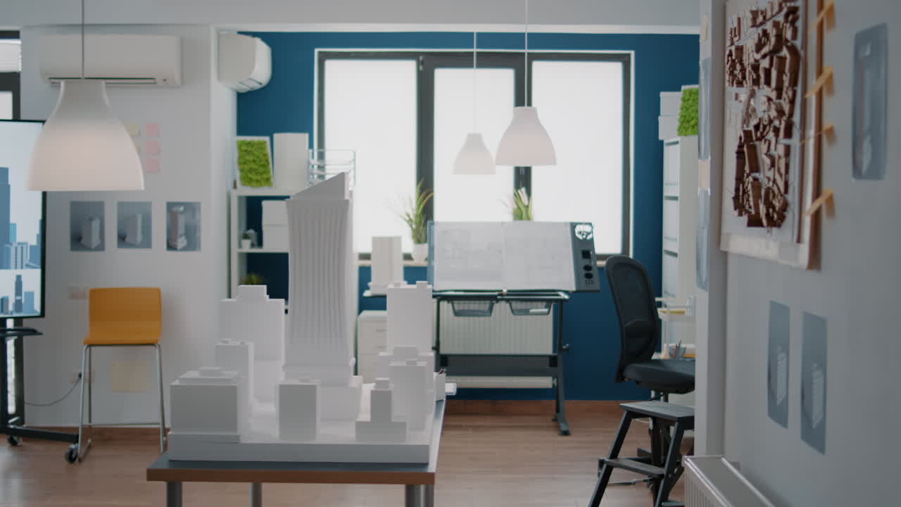 Interior of an architect's office with architectural models and blueprints