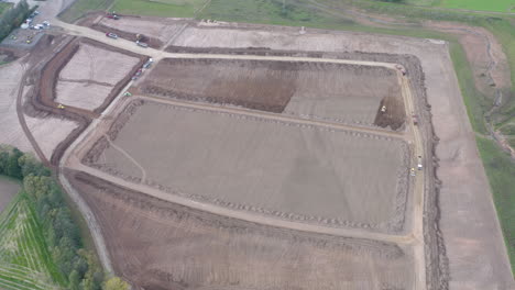 Drone-footage-of-a-construction-side-with-vehicles,-covering-entire-work-area