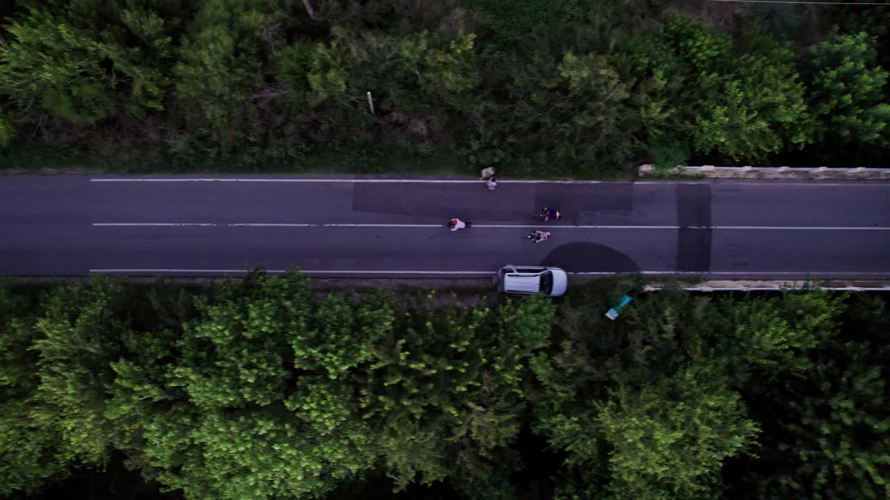 Top View Aerial Tracking of Three Cyclists in a Road, Ignacio Correa, Buenos Aires