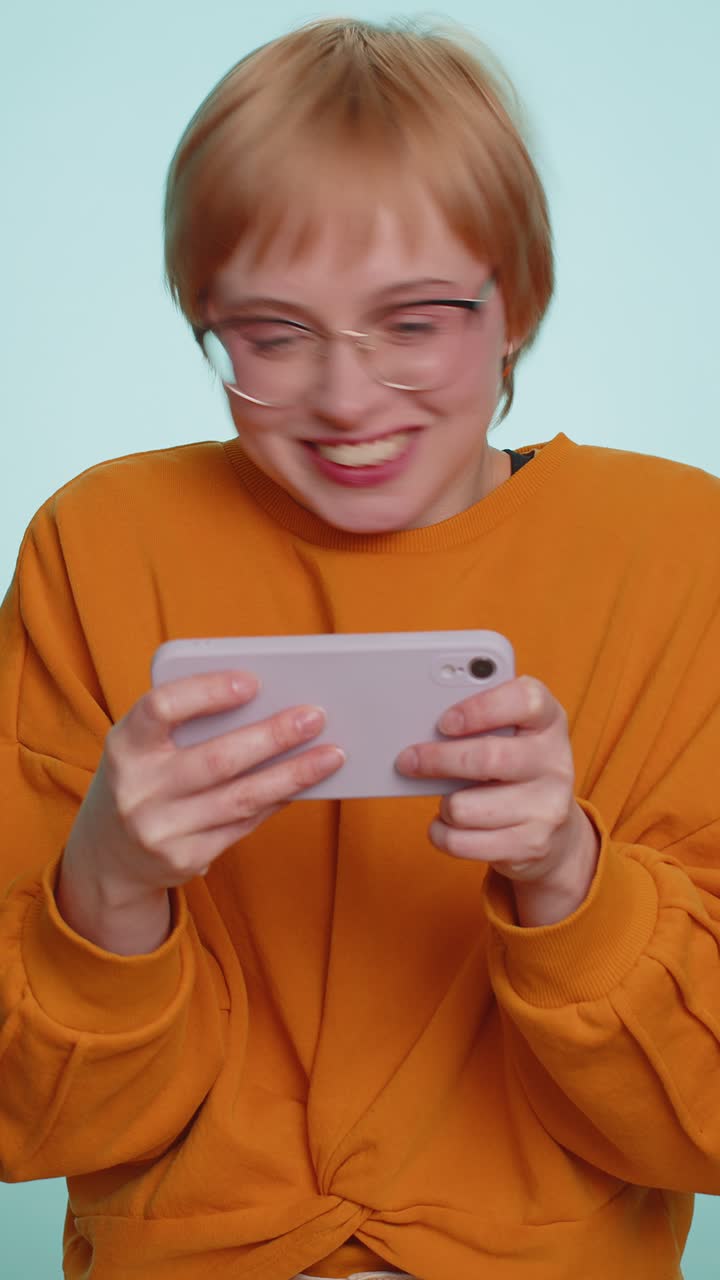 Worried funny addicted tourist lady enthusiastically playing drive racing video game on mobile phone