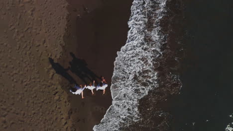 family walking on the beach