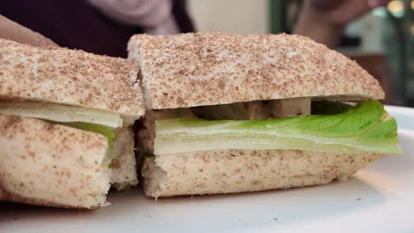 a person eating a sub sandwich