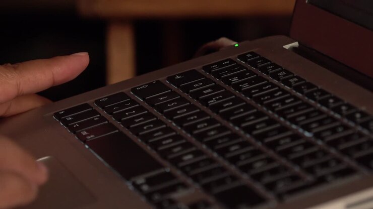 Hands typing on a keyboard