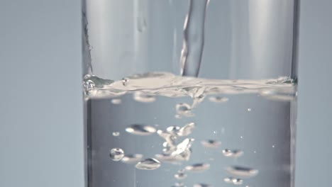 some water falling into a glass