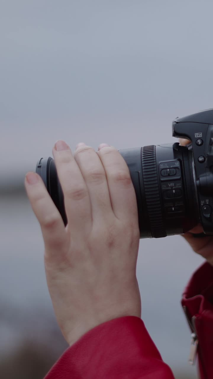 Close-up of hand holding a camera