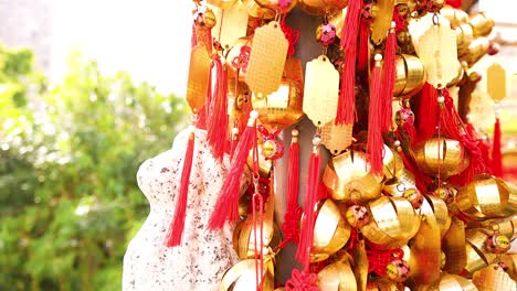 vibrant gold bells with red tassels displayed