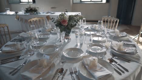 Round table set with beautiful white decoration, camera circles around