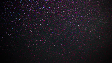 Fly-colorful-glitters-and-dust-on-dark-space