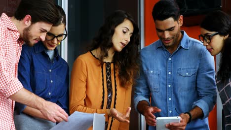 Team-of-graphic-designers-discussing-in-a-meeting