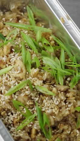 fried rice with sesame seeds and green onions