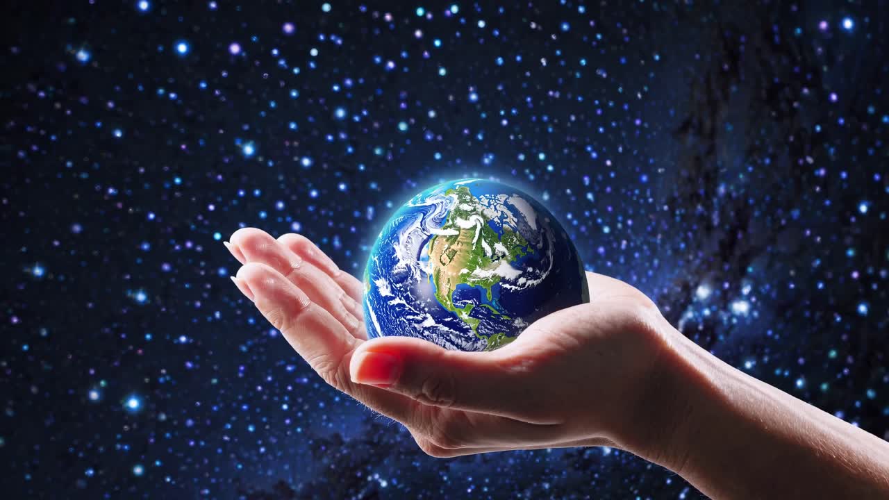 A hand gently cradles Earth against a starry backdrop. Captured from a side angle, this cosmic video