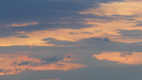 time-lapse of clouds during colorful sunset