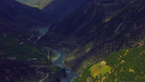 A-picturesque-village-with-beautiful-watery-scenes-round-snowy-mountains-and-river,-as-well-as-charmingly-crafted-greenery