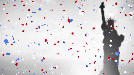 colorful confetti against silhouette of statue of liberty