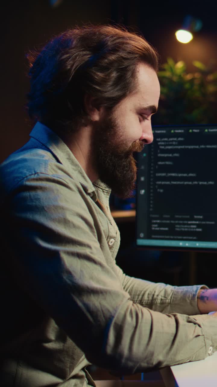 Man Interacting with Virtual Reality Headset and Coding on Computer