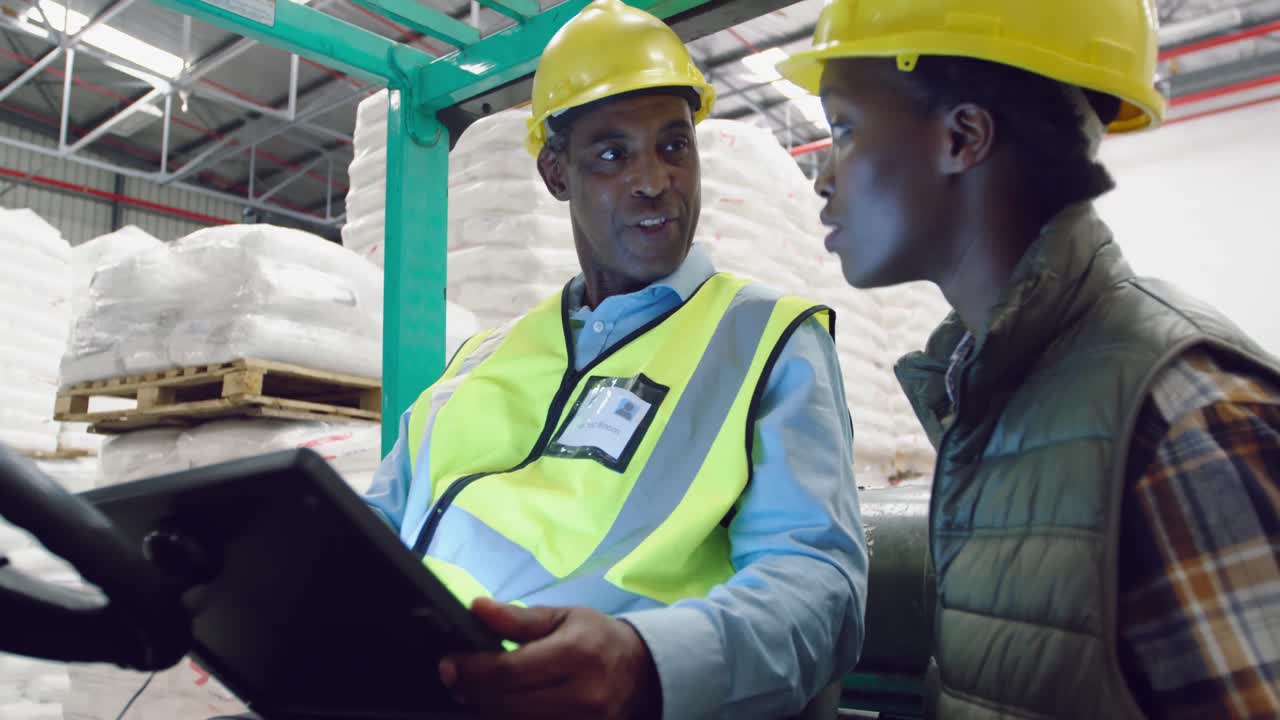 Workers interacting in a warehouse