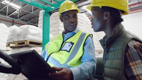 workers interacting in a warehouse