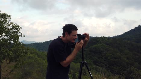 sped up photographer prepping for a shot on the hill