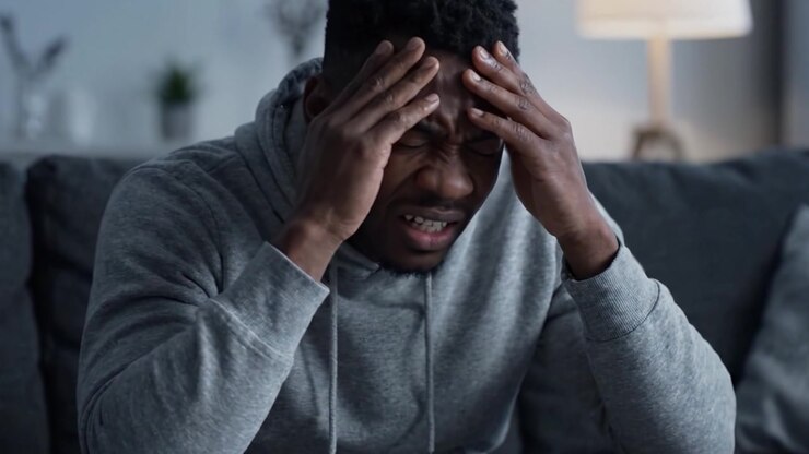 A contemplative moment unfolds as a man grapples with his emotions, revealing the inner turmoil and struggles faced within the realm of mental health.