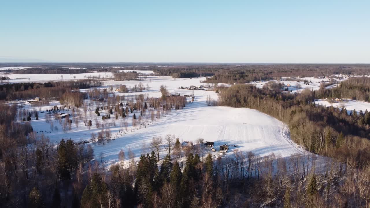 Winter rural landscape with village of Latvia, aerial view