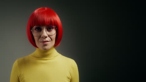 woman with red hair and yellow sweater